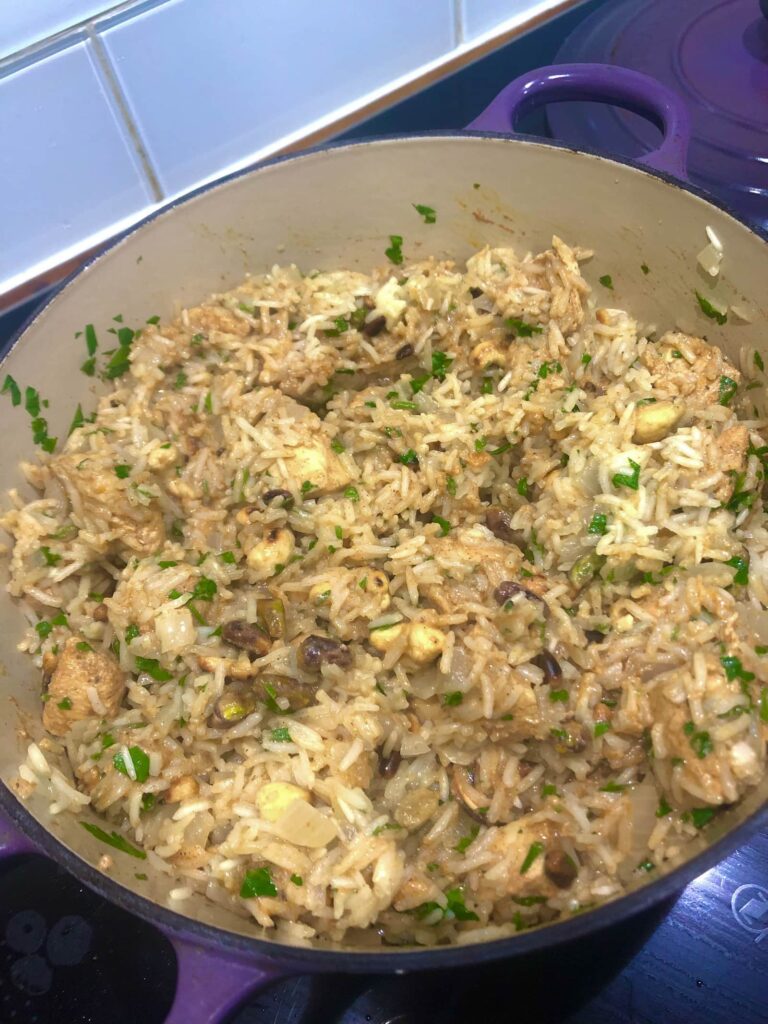 Dutch oven filled with chicken pilaf