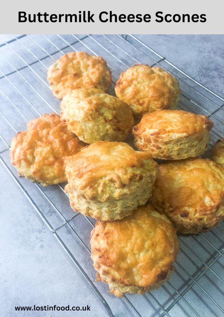 pinnable image with recipe title and wire rack filled with a batch of buttermilk cheese scones