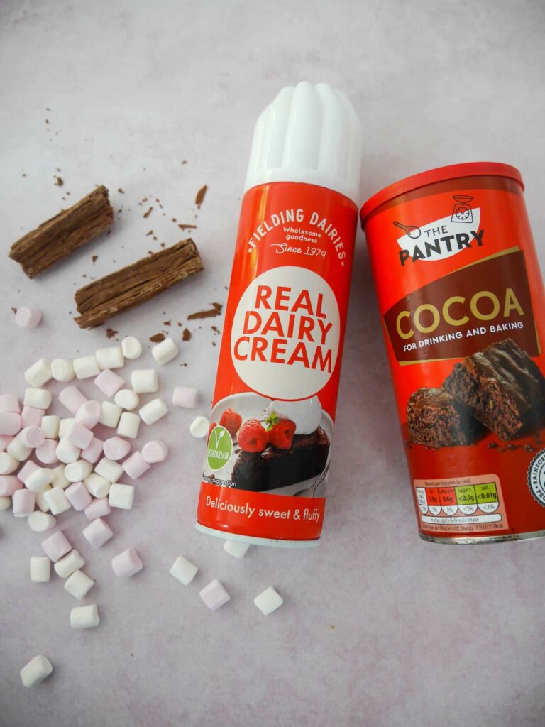 Nutella hot chocolate topping ingredients set on a counter.