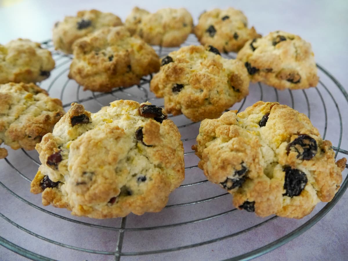 A close up image of rock cakes set on a wire cooling rack.
