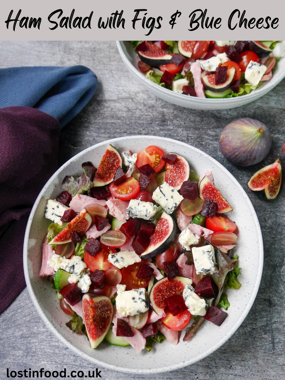 Pinnable image with recipe title and two white bowls filled with ham salad with figs and blue cheese with a whole fig and sliced fig set alongside.