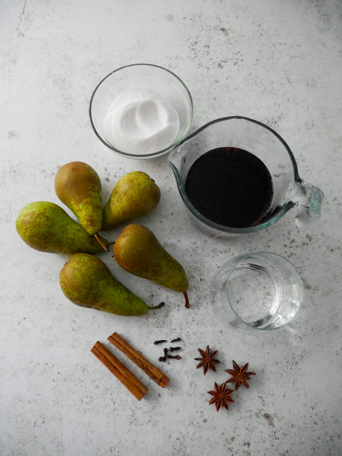 Individual ingredients for mulled pears.