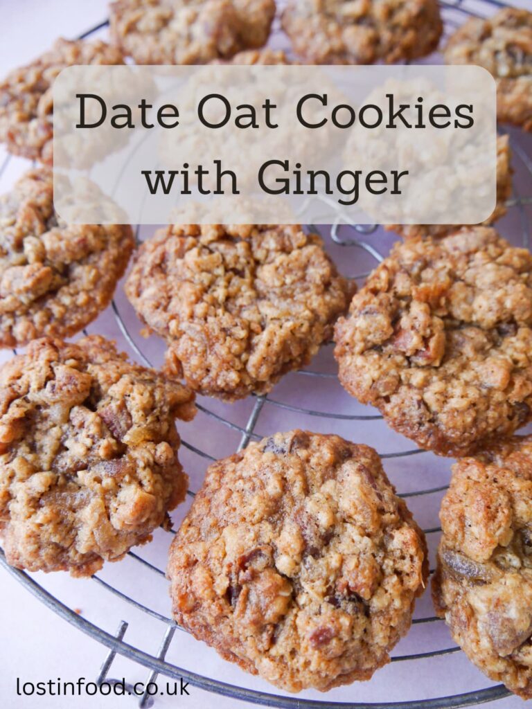 Pinnable image with recipe title and wire cooling rack topped with date oatmeal cookies.