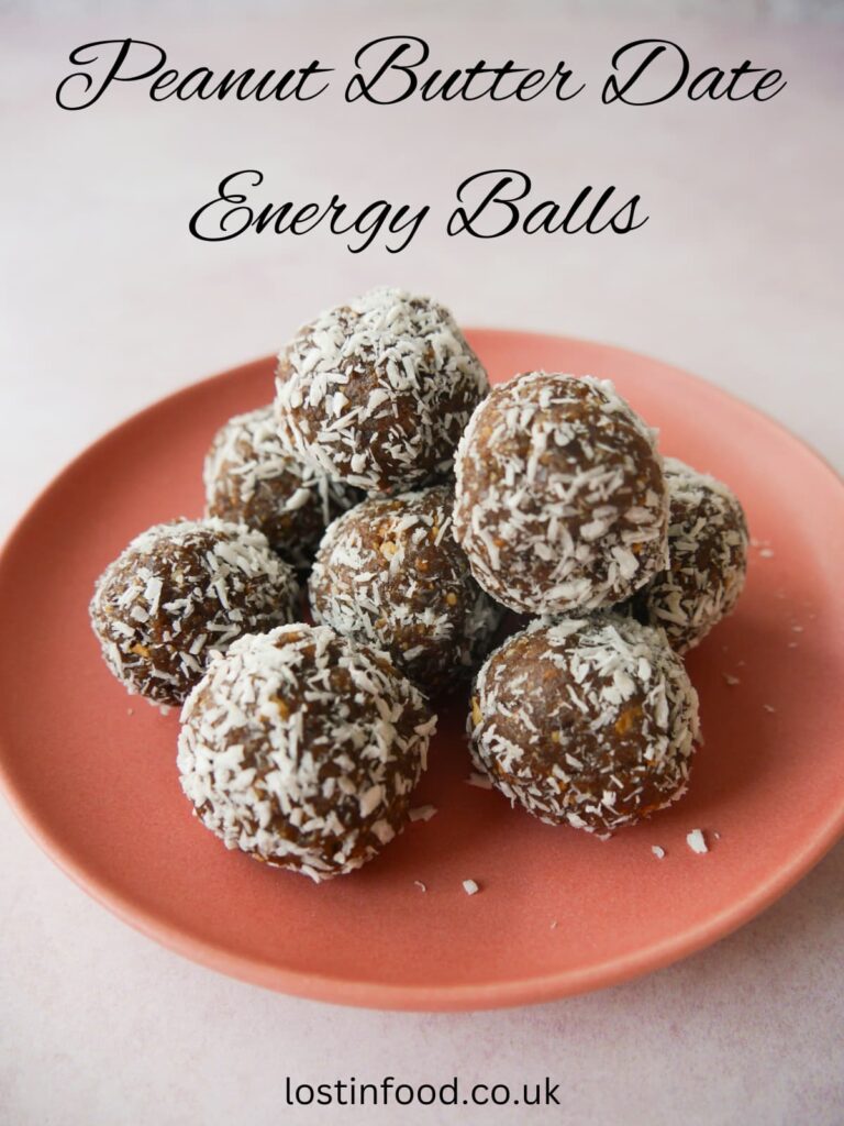 Pinnable image with recipe title and pink plate topped with peanut butter date energy balls.