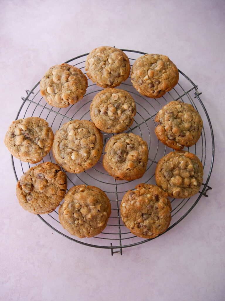 A wire rack topped with baked chocolate hazelnut cookies.