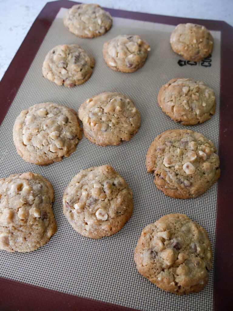 A silicone line baking sheet with baked chocolate hazelnut cookies.