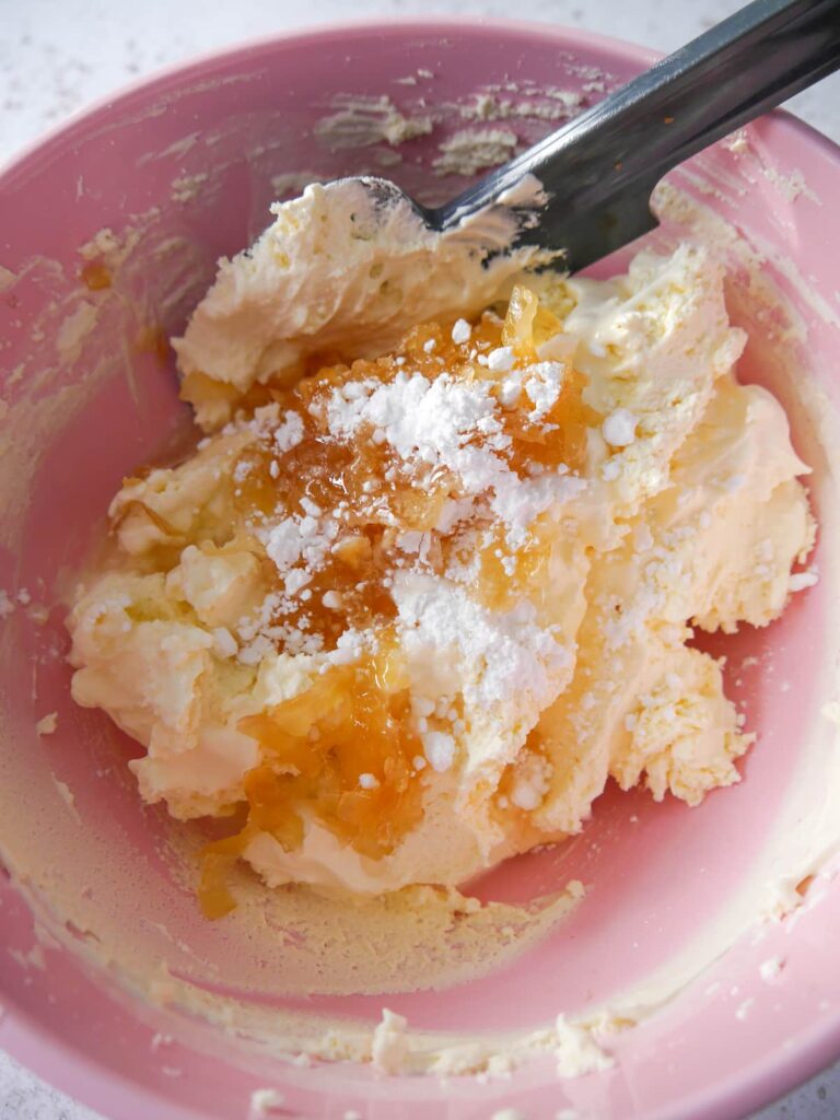 A bowl of whipped double cream with sugar and stem ginger added.