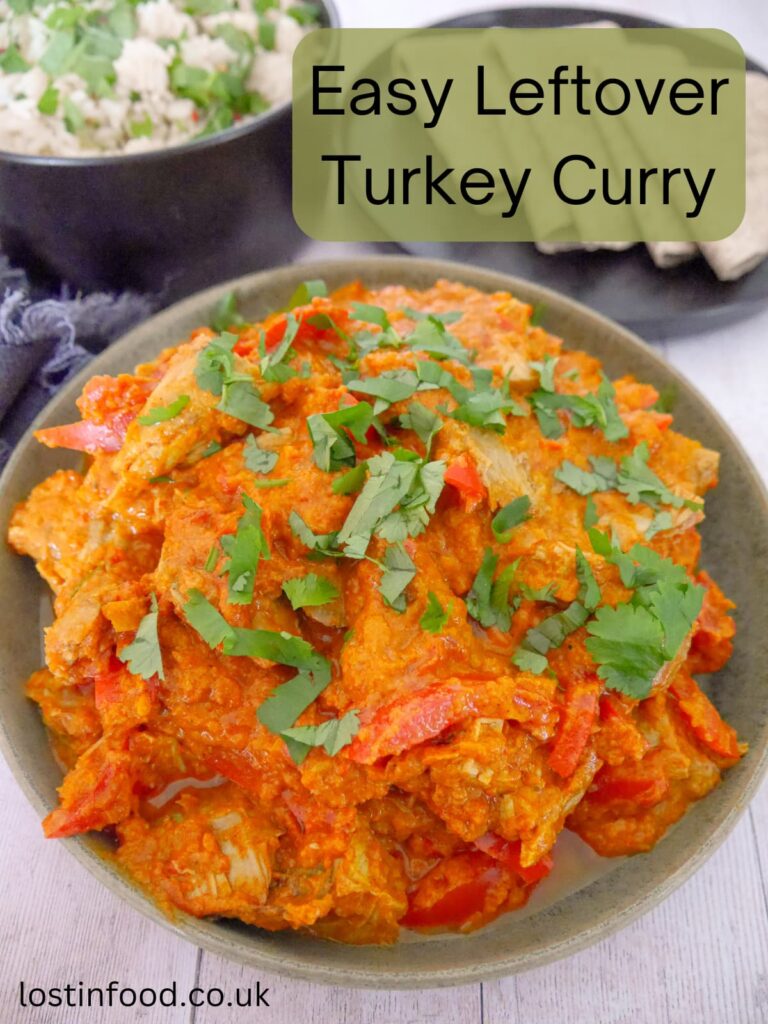 Pinnable image with recipe title and a bowl of leftover turkey curry, serve with sides of chapati flat breads and a bowl of steamed white rice.