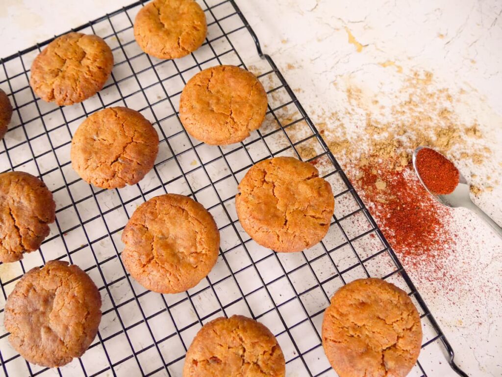 A wire rack of chilli and ginger biscuits.