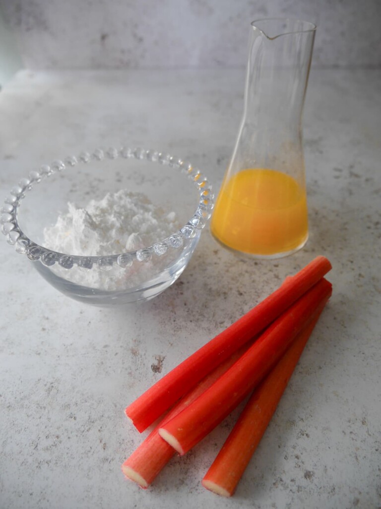 Individual recipe ingredients for rhubarb and orange glaze icing.