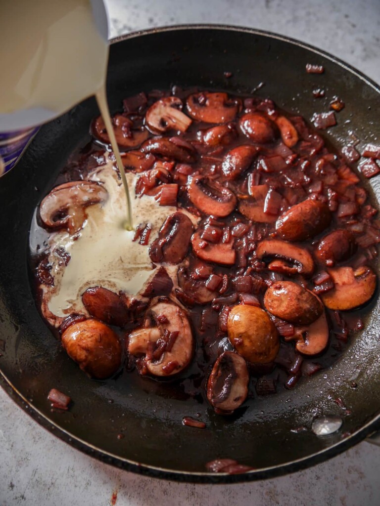 Sauteed mushrooms and shallot, in a reduced red wine sauce, with double cream being added.