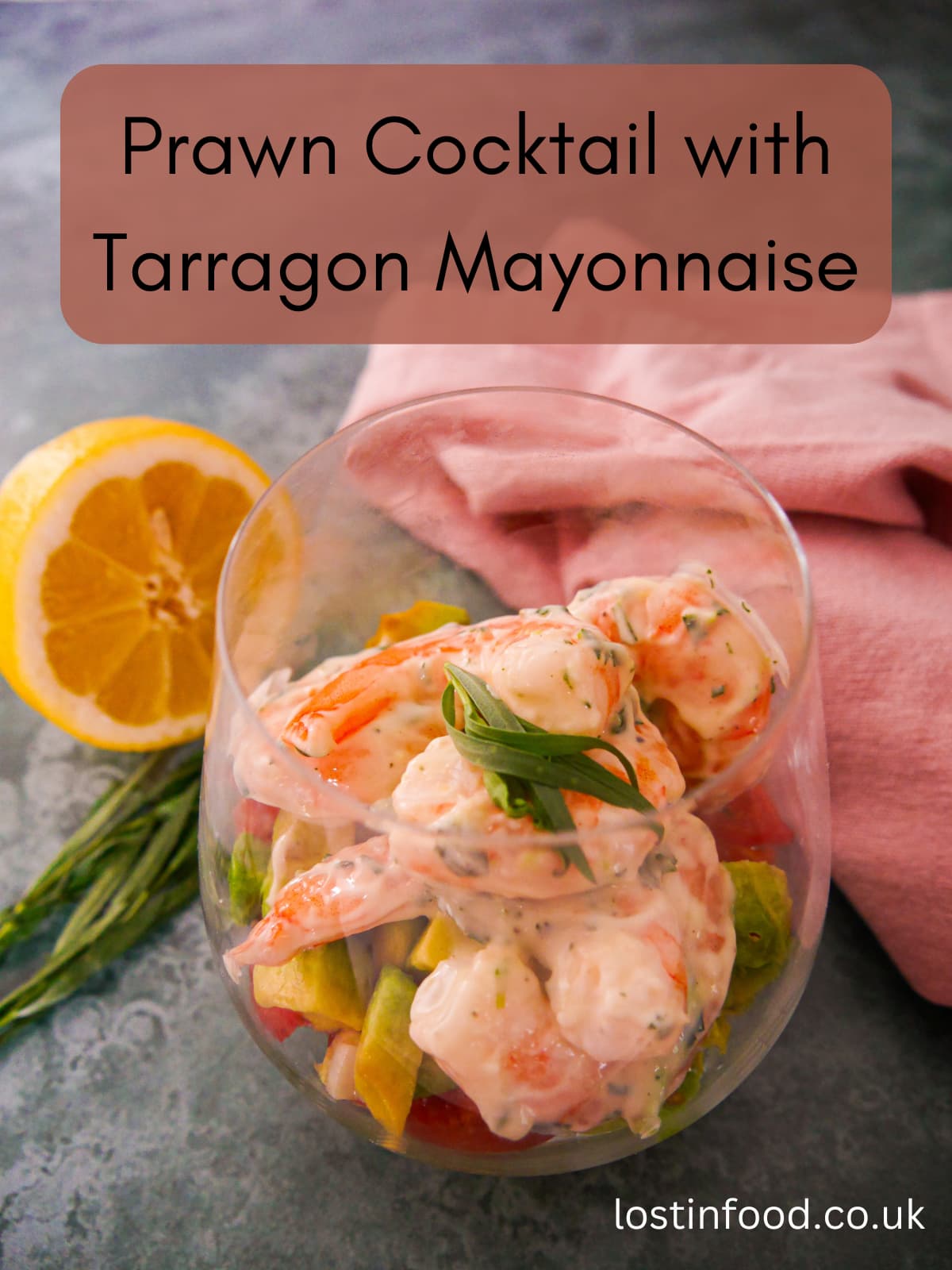 Pinnable image with recipe title and a large glass filled with a base of shredded lettuce, chopped tomato and avocado, topped with king prawns in a tarragon mayonnaise, garnished with fresh tarragon.