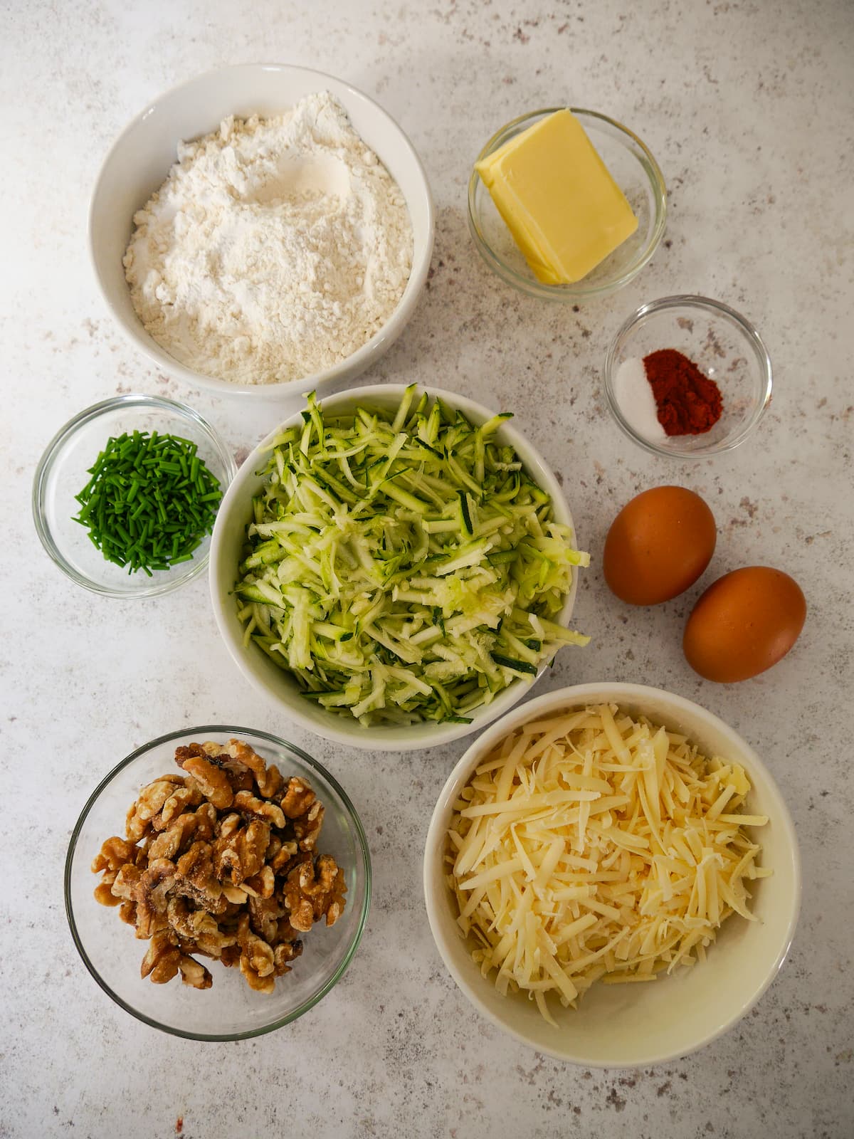 Individual recipe ingredients for courgette and cheese bread.