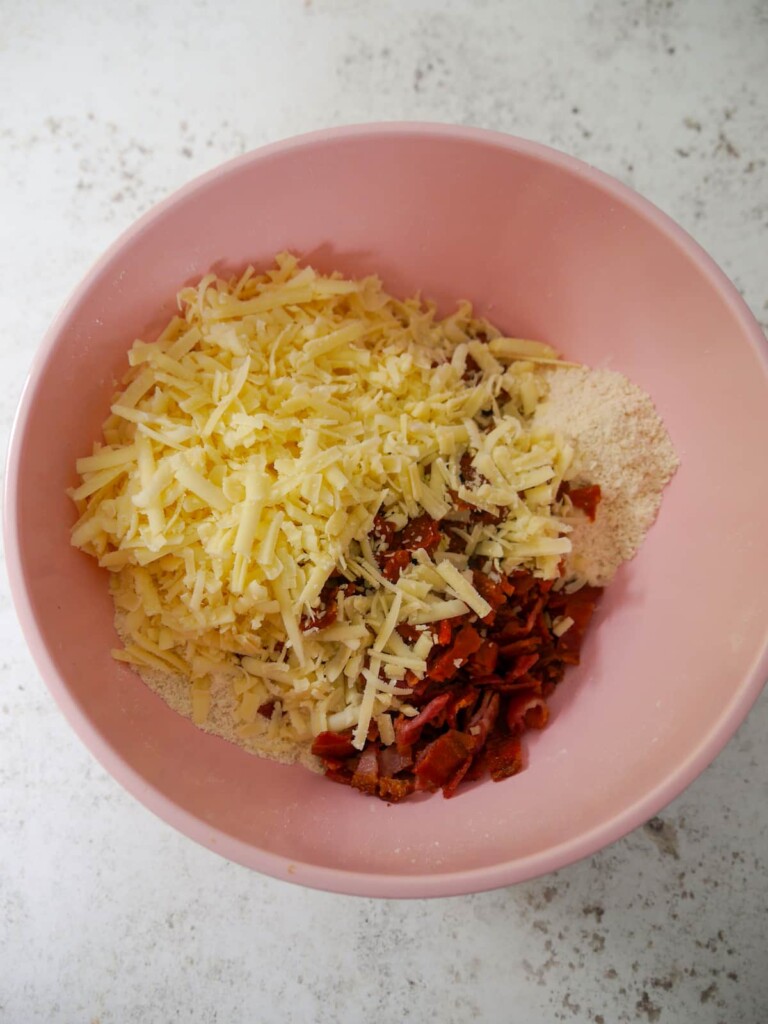 Dry scone mixture with added grated cheese, chopped cooked bacon and chopped sundried tomatoes.