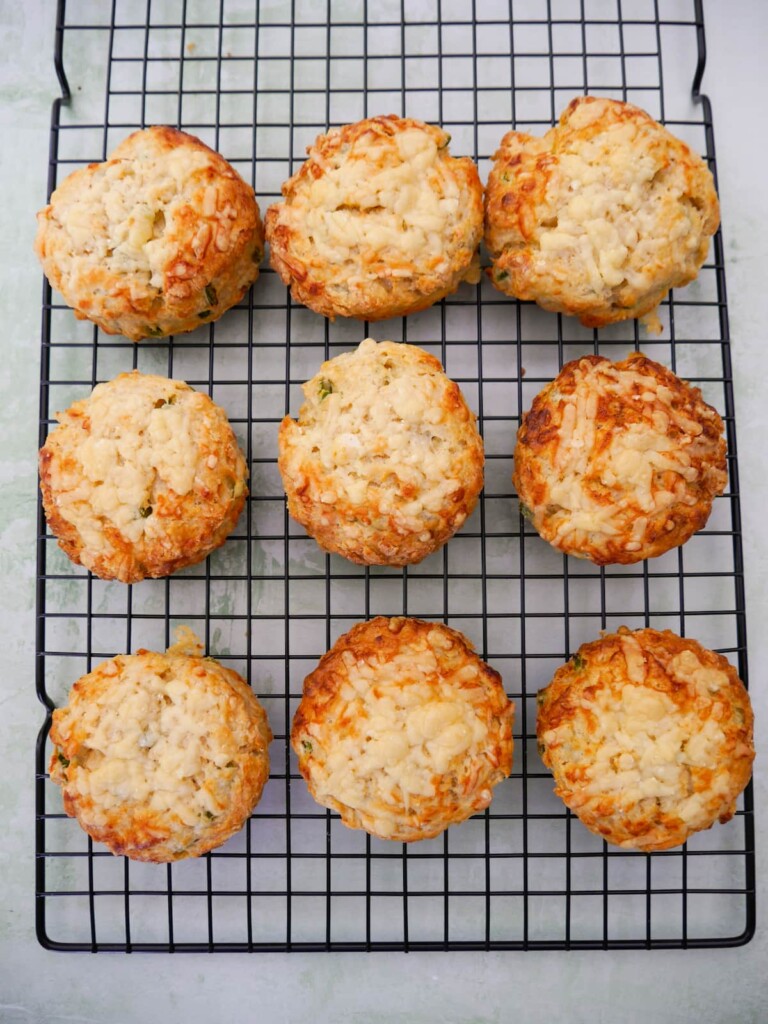 A wire rack of cheese and jalapeno pepper scones.
