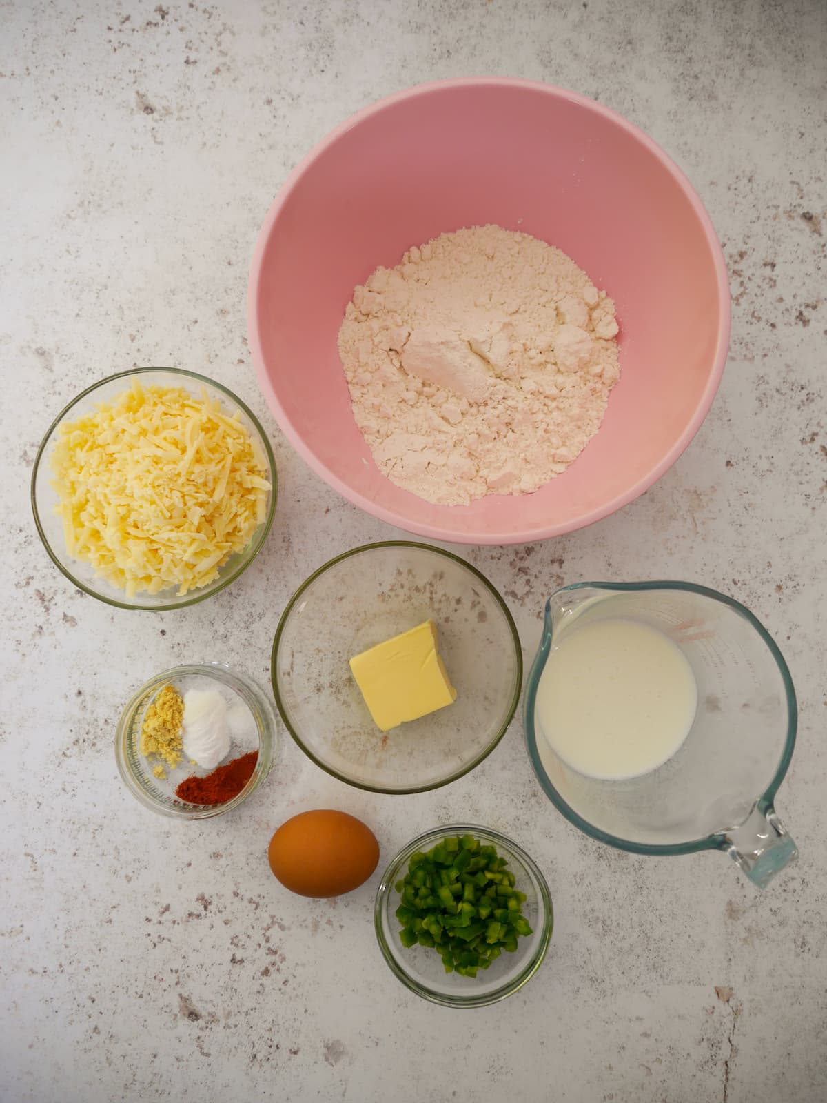 Individual recipe ingredients for cheese and jalapeno scones.