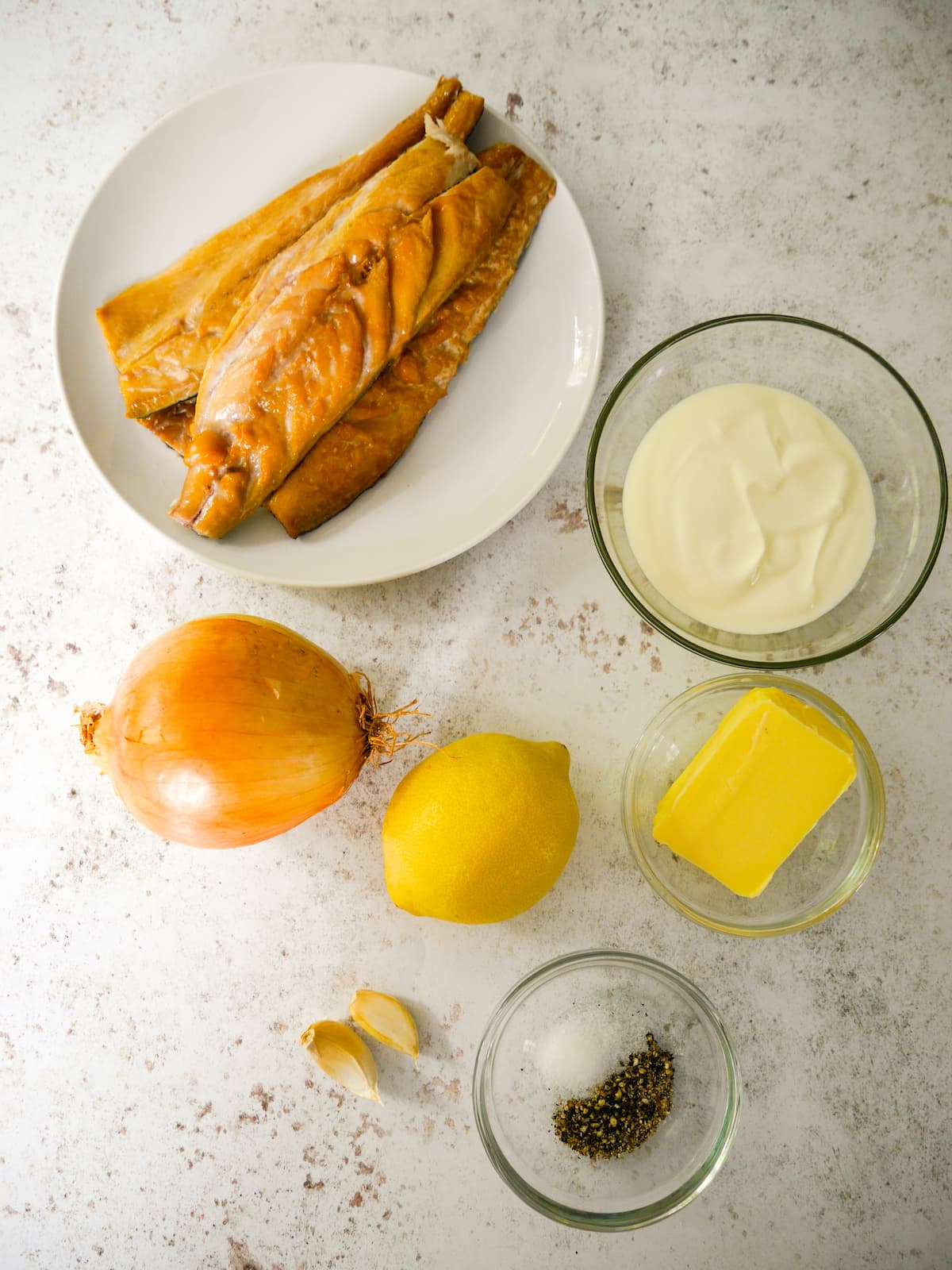 Individual recipe ingredients for making smoked mackerel pate.