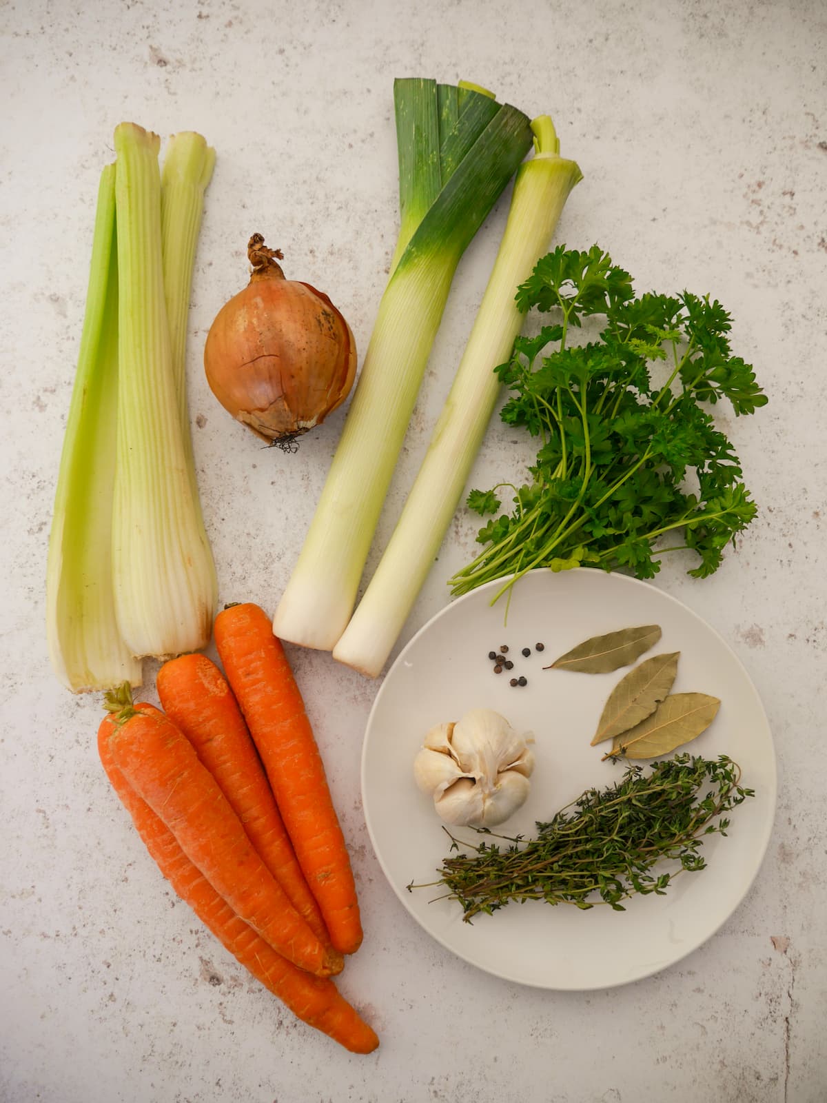 Individual recipe ingredients for making homemade vegetable stock.