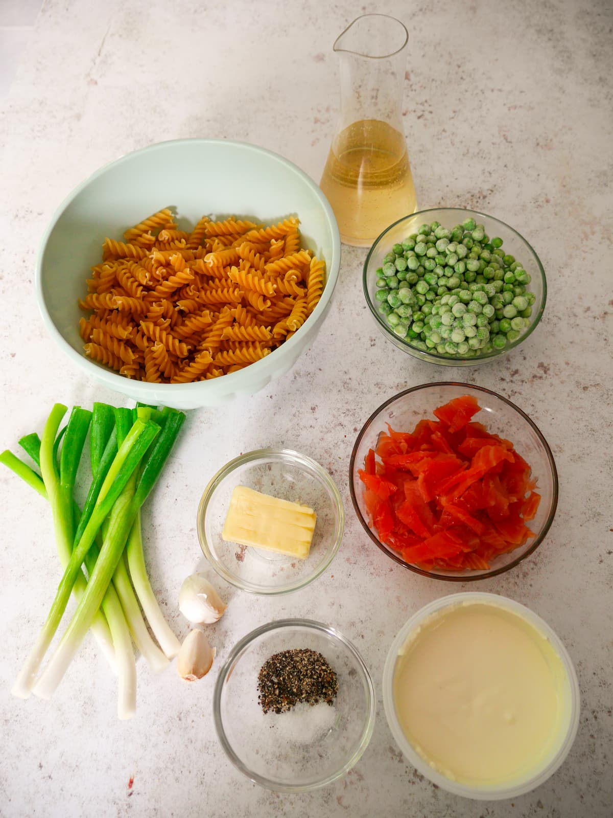 Individual recipe ingredients for smoked salmon pasta.