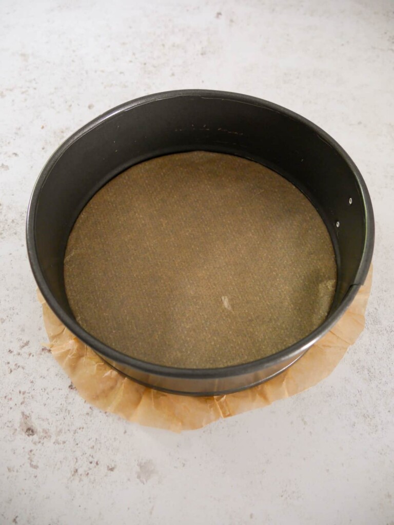 A baking tin lined with baking parchment paper.