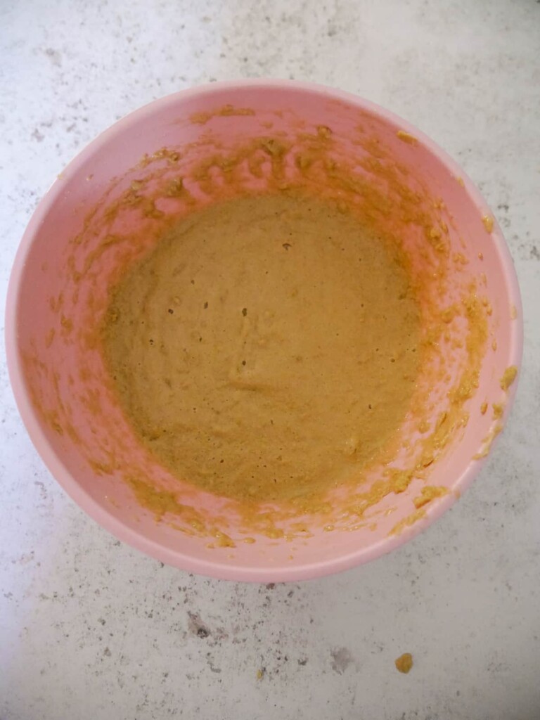 A bowl of combined butter, sugar and egg.