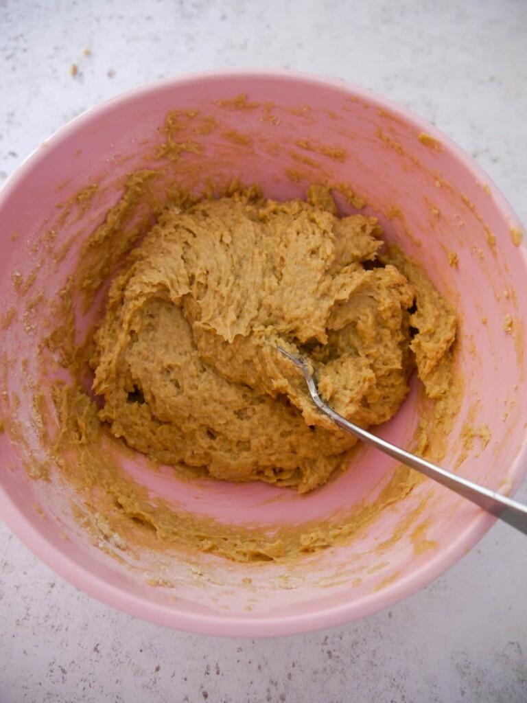 A pink bowl of cake batter.