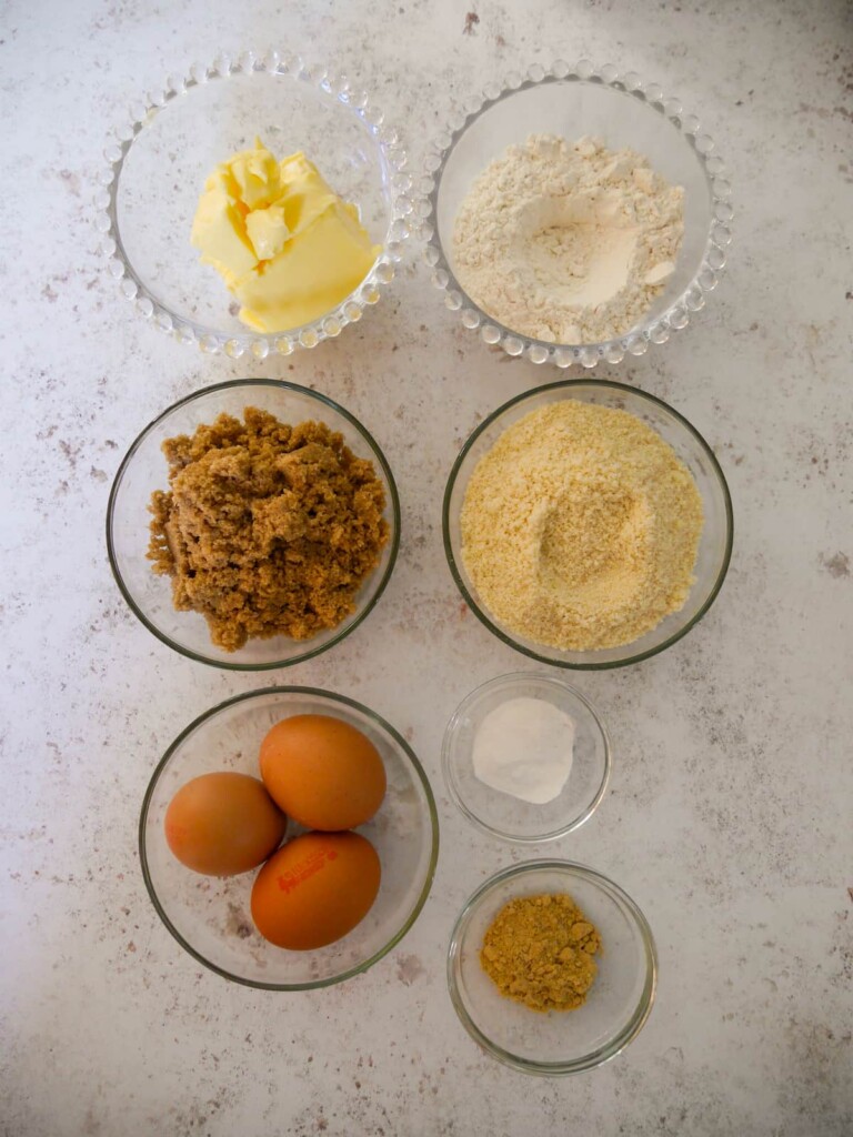 Individual recipe ingredients for making the sponge topping for pear and ginger puddings.