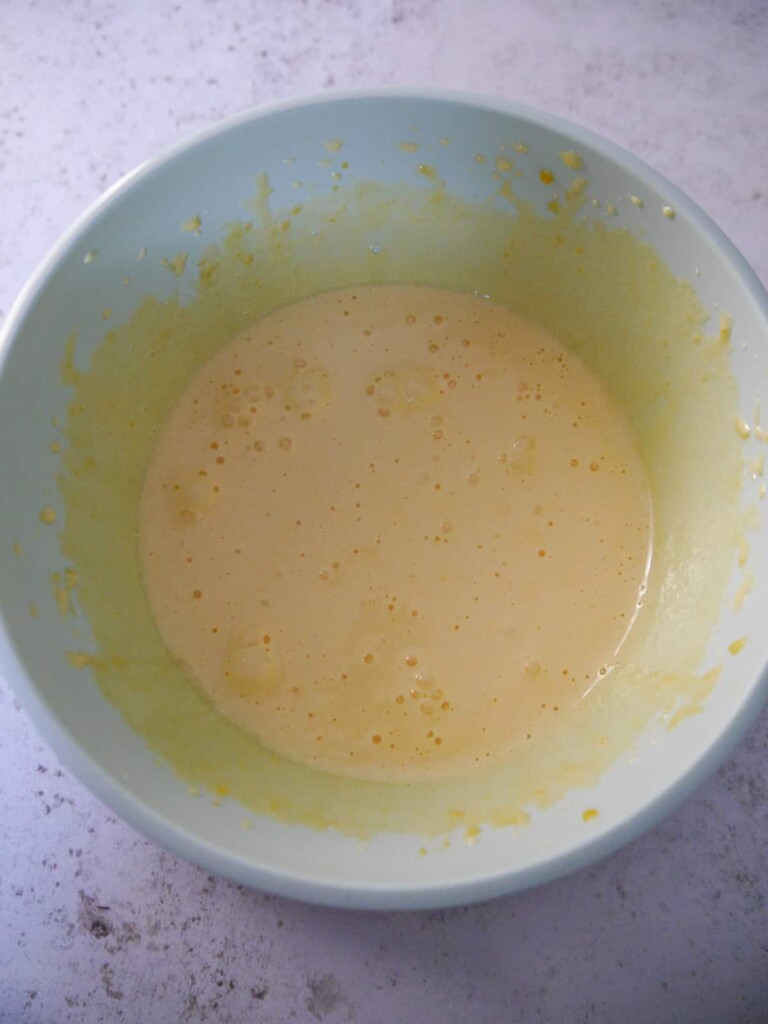 A bowl of whipped egg yolks and sugar combined.