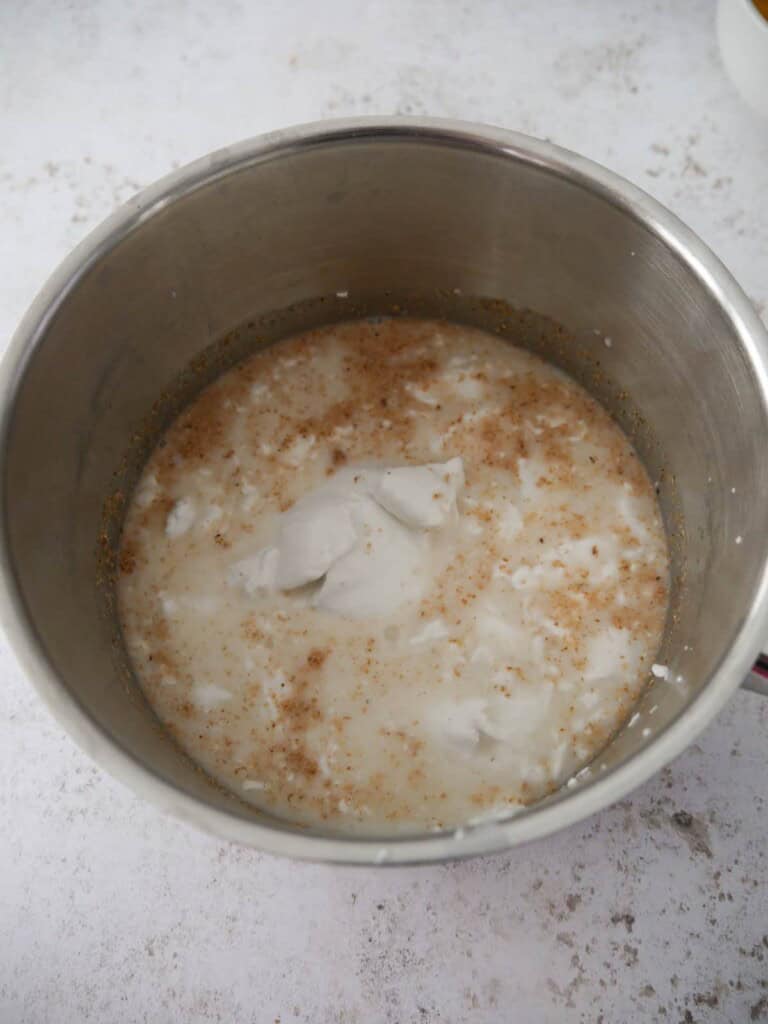 A saucepan of ingredients for coconut rice pudding.