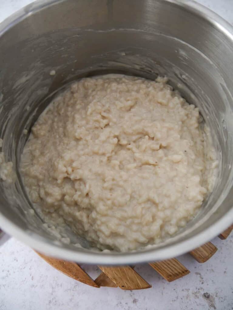 A saucepan of cooked coconut rice pudding.