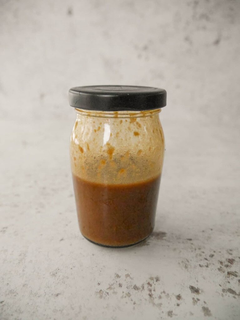A jar of soy and ginger salad dressing.