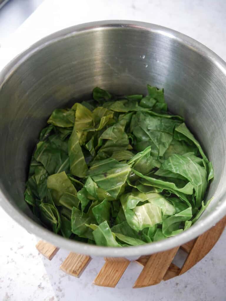 A saucepan of spring greens with a little water added.