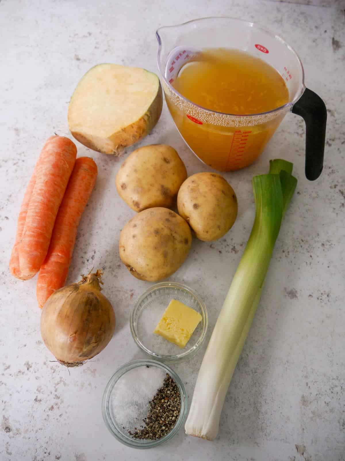 Individual recipe ingredients for making Scottish tattie soup.