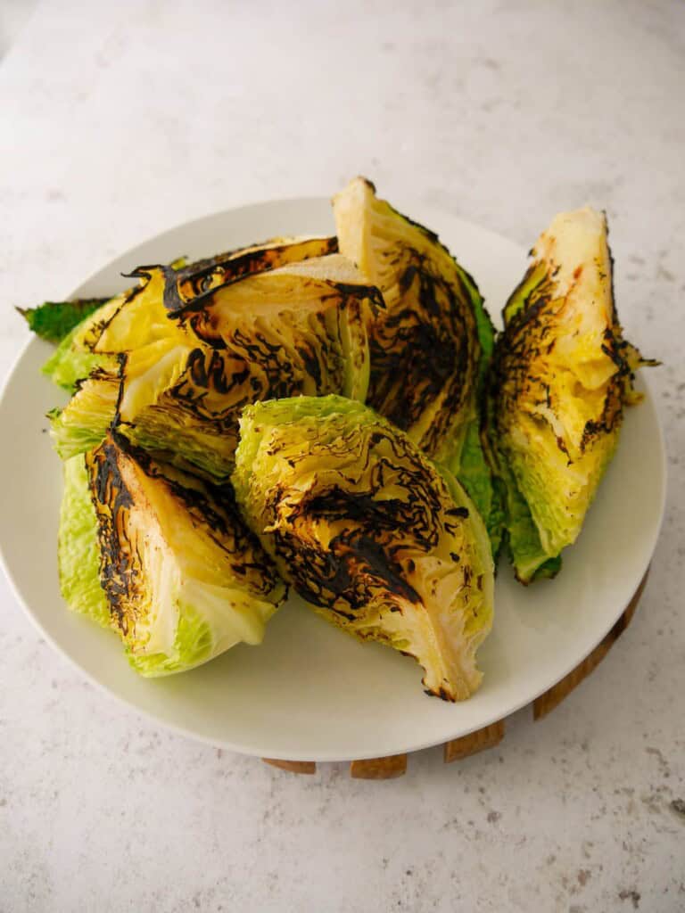 A plate of charred savoy cabbage wedges.