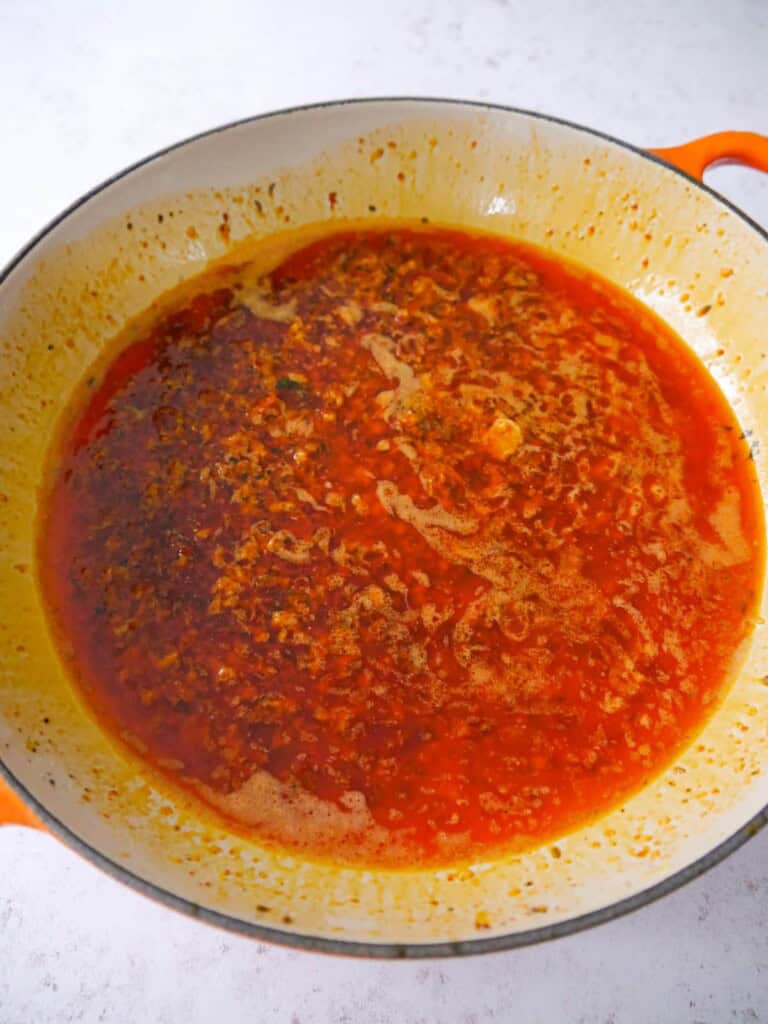 A large skillet of melted harissa and lemon butter.