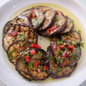 A bowl filled with Italian marinated aubergine slices.