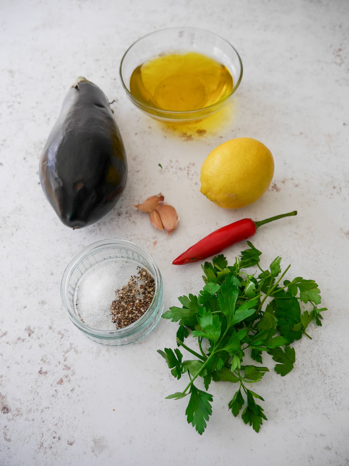 Individual recipe ingredients for making Italian marinated aubergine.