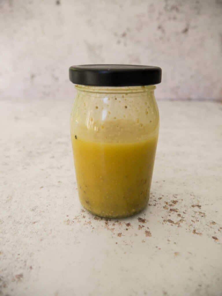 A jar of apple cider vinegar dressing.