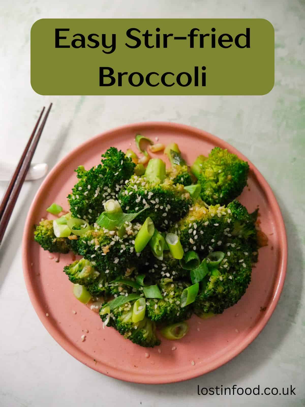 Pinnable image with recipe title and a plate of stir-fried broccoli garnished with sesame seeds and sliced spring onions.