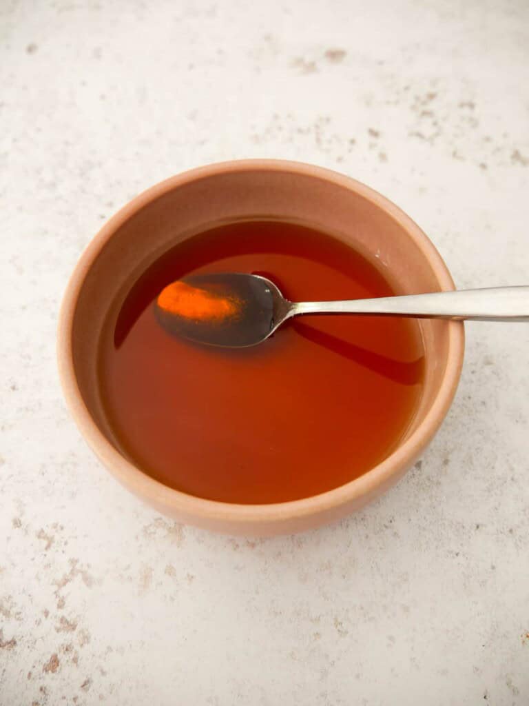 A bowl of mixed sugar and red wine vinegar.