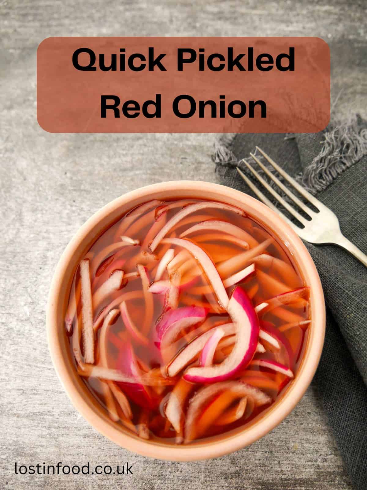Pinnable image with recipe title and a bowl of quick pickled red onions, covered in red wine vinegar.