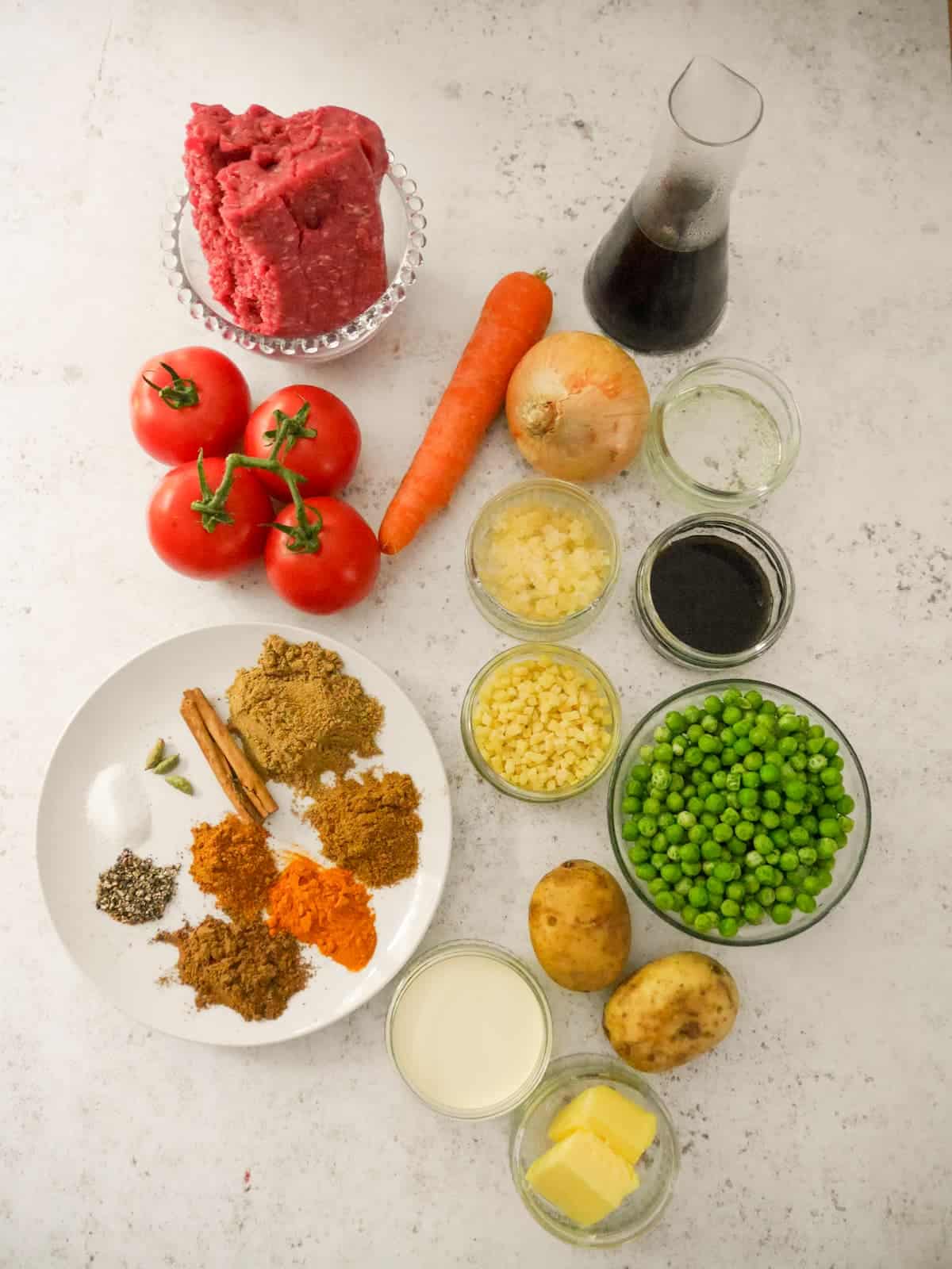Individual recipe ingredients for making masala spiced cottage pie.